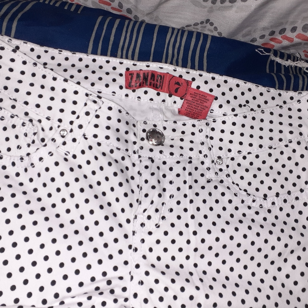 White with black dot pants.